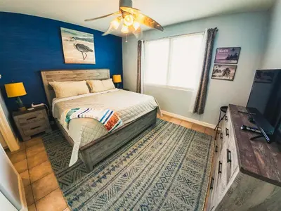 a bedroom with a bed and a ceiling fan at Updated Beach Condo at the Shores of Panama Condos - Unit 918 in Panama City Beach