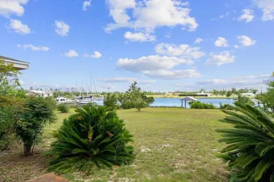 a park with a view of a body of water at Nautical Nirvana-Waterfront Joys from Sunrise Paddles to Hot Tub Sunsets in Panama City