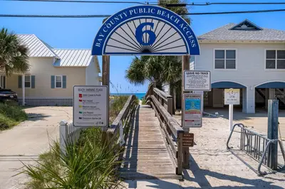 a sign in front of a building on the beach at Merrimac Resort #12 in Panama City Beach
