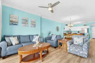 a living room with a couch and chairs and a table at Ocean Villa 1605 in Panama City Beach