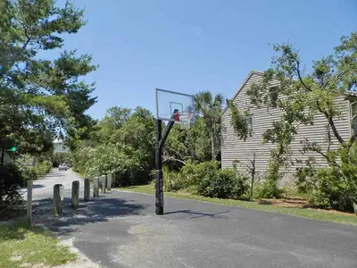 a basketball hoop in the middle of a road at Cassine Station 305 - Sea Ya in Santa Rosa Beach