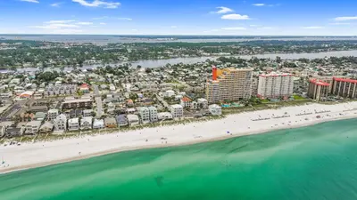 an aerial view of a beach with buildings and the ocean at Beach House - Sugar Sands by Panhandle Getaways in Panama City Beach