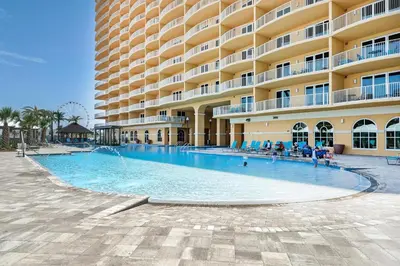 a large swimming pool in front of a large building at Calypso 3-1601 - Corine's Corner in Panama City Beach
