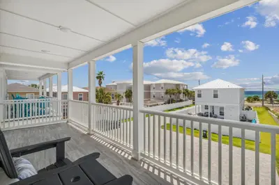 a balcony with a view of the ocean at Laguna Beach Pearl by InJoy Vacations in Panama City Beach