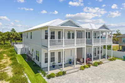 an aerial view of a white house at Laguna Beach Pearl by InJoy Vacations in Panama City Beach