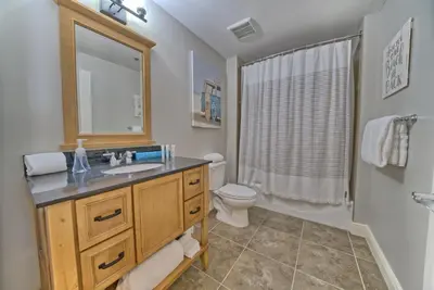 a bathroom with a sink and a toilet at OCEAN FRONT CONDO w INCREDIBLE VIEWS in Panama City Beach