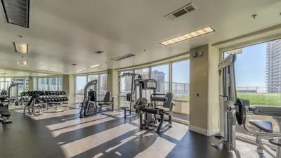 a gym with treadmills and cardio equipment in a building at Penthouse Perfection at Laketown Wharf #2127 by Nautical Properties in Panama City Beach