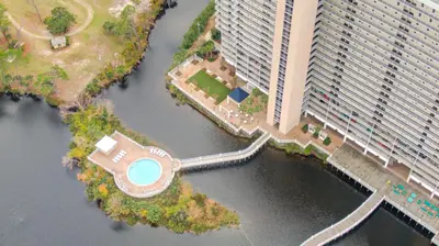 an aerial view of a large building next to a body of water at Penthouse Perfection at Laketown Wharf #2127 by Nautical Properties in Panama City Beach