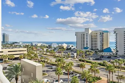 a view of a city with palm trees and buildings at The Beach Scene at Laketown Wharf #524 by Nautical Properties in Panama City Beach