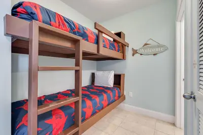 a bedroom with two bunk beds in a room at Laketown Wharf 2018 in Panama City Beach