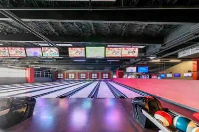 a bowling alley with lanes and televisions at Laketown Wharf 2018 in Panama City Beach