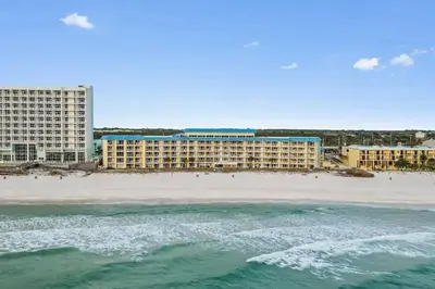 a view of the hotel from the beach at Slice o’ Paradise - Gulf Front! Walk to Pier Park in Panama City Beach