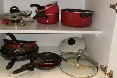 three pots and pans on a stove in a kitchen at McDrifty's Hideaway in Panama City Beach