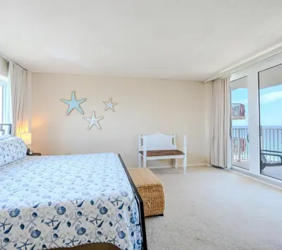 a bedroom with a bed with stars on the wall at Dunes of Panama Resort in Panama City Beach