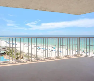 a balcony with a view of the beach at Dunes of Panama Resort in Panama City Beach
