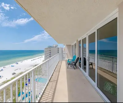 a balcony with a view of the beach at Dunes of Panama Resort in Panama City Beach