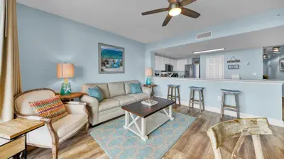 a living room with a couch and a table at Beachfront Condo #1413 Majestic Beach Resort in Panama City Beach
