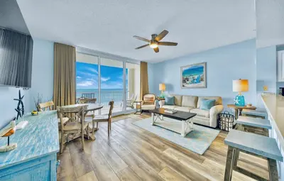 a living room with a couch and a table at Beachfront Condo #1413 Majestic Beach Resort in Panama City Beach