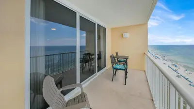 a balcony with chairs and a view of the ocean at Beachfront Condo #1413 Majestic Beach Resort in Panama City Beach