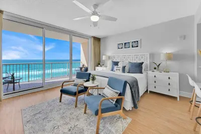 a bedroom with a bed with a view of the ocean at Beachfront Condo #608 at Majestic Beach Resort in Panama City Beach