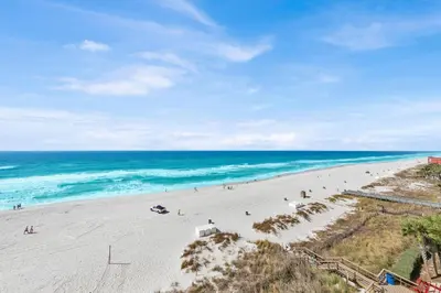 an overhead view of a beach with people on it at Beachfront Condo #608 at Majestic Beach Resort in Panama City Beach