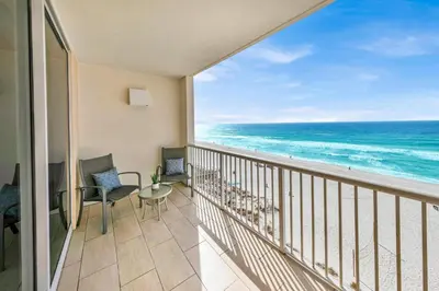 a balcony with a view of the ocean at Beachfront Condo #608 at Majestic Beach Resort in Panama City Beach