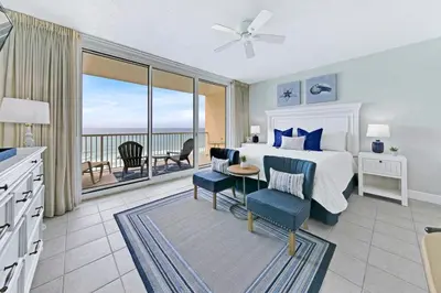 a bedroom with a bed and a view of the ocean at Beachfront Condo #712 at Majestic Beach Resort in Panama City Beach