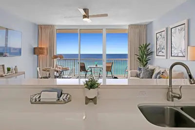 a kitchen with a view of the ocean at Beachfront Condo #906 at Majestic in Panama City Beach