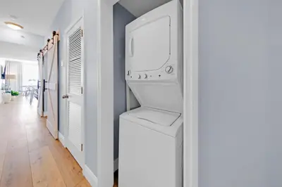 a laundry room with a washer and dryer at Beachfront Condo #906 at Majestic in Panama City Beach