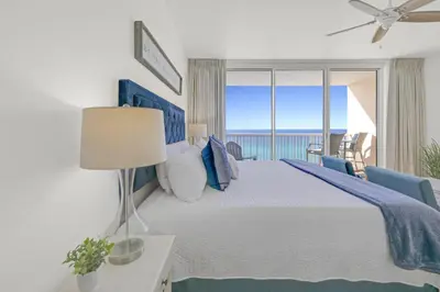 a bedroom with a bed with a view of the ocean at Beachfront Studio #1112 at Majestic in Panama City Beach