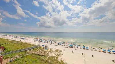 an overhead view of a beach with umbrellas and the ocean at Beachfront Studio #212 at Majestic in Panama City Beach