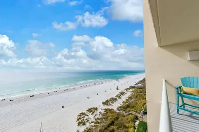 a view of the beach from the balcony of a condo at Beachfront Studio #709 at Majestic in Panama City Beach