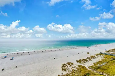 an aerial view of a beach with people on it at Beachfront Studio #709 at Majestic in Panama City Beach