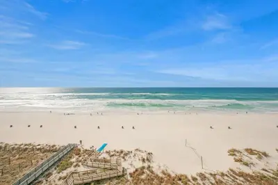 a beach with a bunch of people on it at Beachfront Studio #809 at Majestic in Panama City Beach