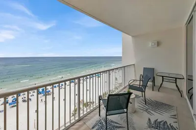 a balcony with a view of the beach at Beachfront Studio #809 at Majestic in Panama City Beach