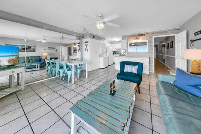 a living room with a couch and a dining room at Oceanfront Condo #1320 at Summit in Panama City Beach