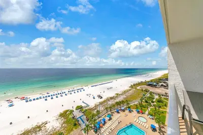 a view of the beach from a balcony of a resort at Oceanfront Condo #1320 at Summit in Panama City Beach