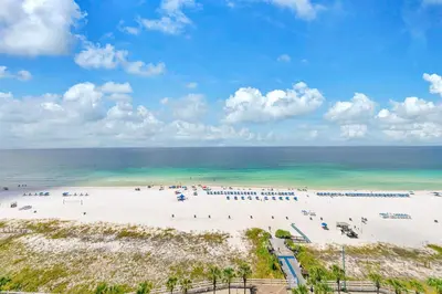 an overhead view of a beach with people on it at Oceanfront Condo #1320 at Summit in Panama City Beach