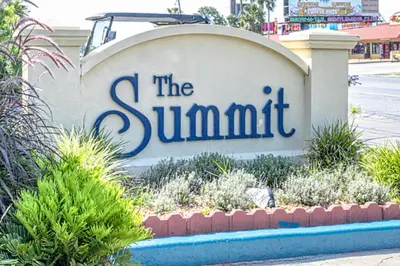 a sign for the summit in front of a street at Oceanfront Condo #629 at Summit Beach Resort in Panama City Beach