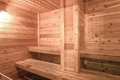 a wooden sauna with a bench in it at Oceanfront Condo #629 at Summit Beach Resort in Panama City Beach