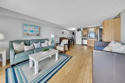 a living room with a couch and a table at Oceanfront Condo #629 at Summit Beach Resort in Panama City Beach