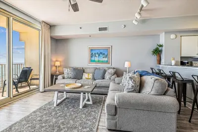 a living room with a couch and a table at Shores of Panama # 1902 condo in Panama City Beach