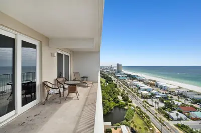 a view of the beach from the balcony of a condo at Laketown Wharf #1807 by Nautical Properties in Panama City Beach