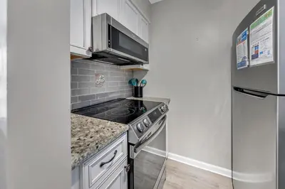 a kitchen with a stove and a refrigerator at Endless Summer E2 in Panama City Beach