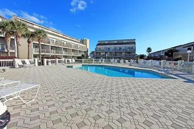 a courtyard with a swimming pool in a building at Endless Summer E2 in Panama City Beach