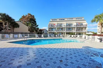 a swimming pool in front of a apartment building at Endless Summer E2 in Panama City Beach