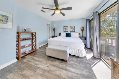 a bedroom with a bed and a ceiling fan at Cassine Gardens 212 in Santa Rosa Beach