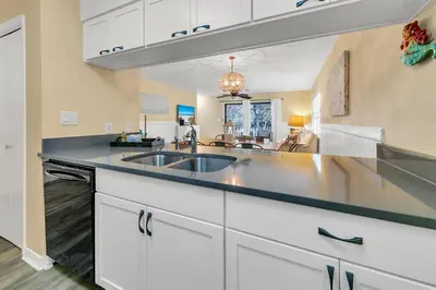 a kitchen with a sink and a counter top at Cassine Gardens 212 in Santa Rosa Beach