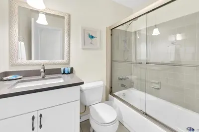 a bathroom with a toilet and a sink and a shower at Cassine Gardens 212 in Santa Rosa Beach