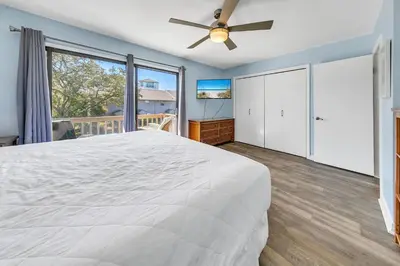 a bedroom with a bed and a ceiling fan at Cassine Gardens 212 in Santa Rosa Beach